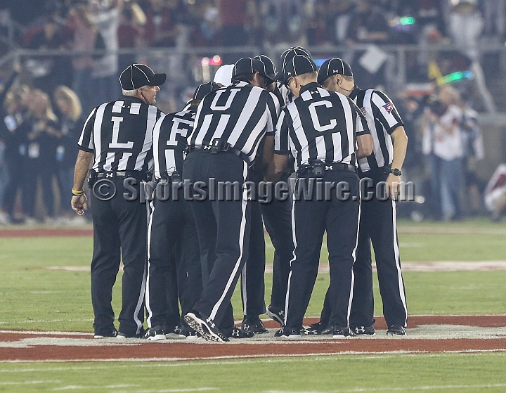 20181006StanfordUtah-009.JPG - Oct. 6, 2018; Stanford, CA.; Game officials huddle prior to an NCAA football game between the Stanford Cardinal and the Utah Utes at Stanford Stadium. Utah defeated Stanford 40-21. 